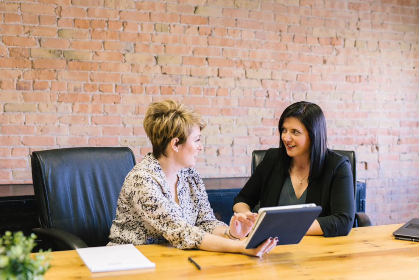 Two people discussing in a business meeting